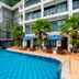 Sabai Mansion Pool & Spa in Krabi with an outdoor pool, palm trees, and guest balconies