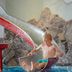 Vier Jahreszeiten Am Schluchsee indoor water slide with a child splashing into the pool, Schluchsee