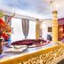 Schlosshotel Lacknerhof in Flachau: lavish suite with round whirlpool tub and ornate four-poster bed