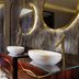 Riva del Sole Resort & Spa bathroom with double vessel sinks and marble shower in Castiglione della Pescaia