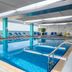 Premier Inn Abu Dhabi International Airport indoor pool with lounge chairs in Abu Dhabi