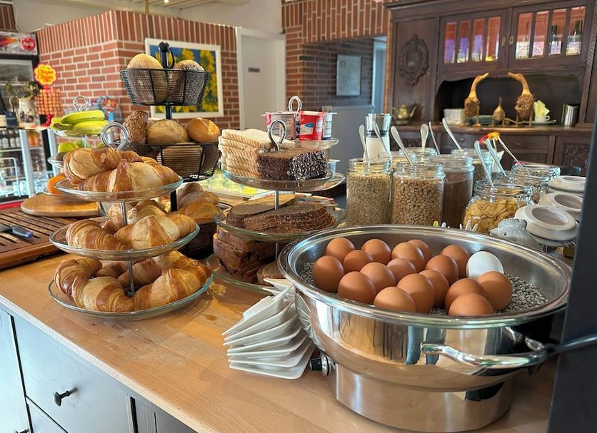 Breakfast buffet at das alte Wasserwerk in Bad Bentheim with eggs, pastries, bread and cereals