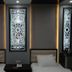 Safir Hotel in Dushanbe guest room with two beds and decorative backlit wall panels