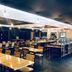 Hotel Seri Malaysia Johor Bahru dining room with rows of tables, chairs and buffet counters