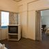 Hotel Chevron International, Ludhiāna guest room with bed, TV, and window view
