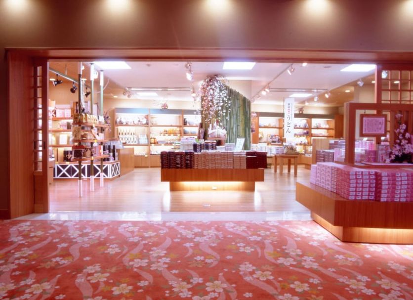 Kotohira Grand Hotel Sakuranosho lobby shop with illuminated display tables in Kotohira