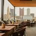 The Junto in Columbus rooftop terrace with city skyline views and outdoor seating