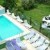 Gultepe Apartments in Kusadasi outdoor pool with sun loungers and grassy views