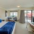 Finns Paekakariki room with king bed, sitting area, and balcony view in Paekakariki