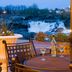 Hilton Garden Inn Auburn Lewiston Riverwatch patio with table overlooking a waterfall and river