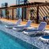 Rooftop pool with lounge chairs at Gran Bourbon Hotel Asuncion in Asuncion