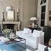 La Divine Comédie-Suites Deluxe in Avignon, elegant lounge with fireplace and white seating