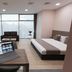 B1 Boutique Hotel Sofia room in Sofia with bed, desk, sofa and large window view