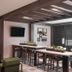 Hampton Inn & Suites Los Angeles/Sherman Oaks lounge with bar seating and wall-mounted TV
