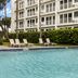 Club Wyndham Sea Gardens in Pompano Beach with palm trees, pool, and beachfront building