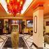 Hotel Ik London Residency Hyderabad lobby with grand chandelier and decorative vase