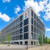 Ibis Hamburg City in Hamburg, modern exterior with large windows under a blue sky