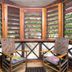 Bananarama Dive & Beach Resort in West Bay: screened gazebo with chairs and garden views