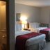 Nader's Motel & Suites Ludington room with two double beds and adjoining bathroom