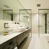 Nova M Olaya Hotel Edge By Rotana in Riyadh bathroom with walk-in shower, freestanding tub and double vanity