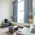 Arass Hotel & Business Flats Antwerp suite with kitchenette, dining table, staircase and seating area