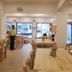 The Unicontinental - Campus Accommodation in Mumbai dining area with wooden tables and staff inside
