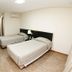 Hotel Financial in Belo Horizonte: twin guest room with two beds, wall-mounted TV and air conditioner