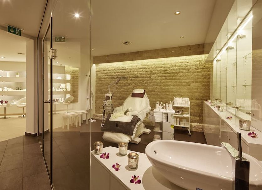 Schloss Reinach spa bathroom in Freiburg im Breisgau with soaking tub, treatment chair and glass display