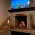 Villa Montserrat in Campos do Jordão with fireplace and TV showing Eiffel Tower view