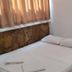 Cann Hotel Konakli room with a bed, bedside table and curtained window
