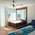 Playasol in Roquetas de Mar: ocean-view room with jacuzzi tub, balcony, and blue chair