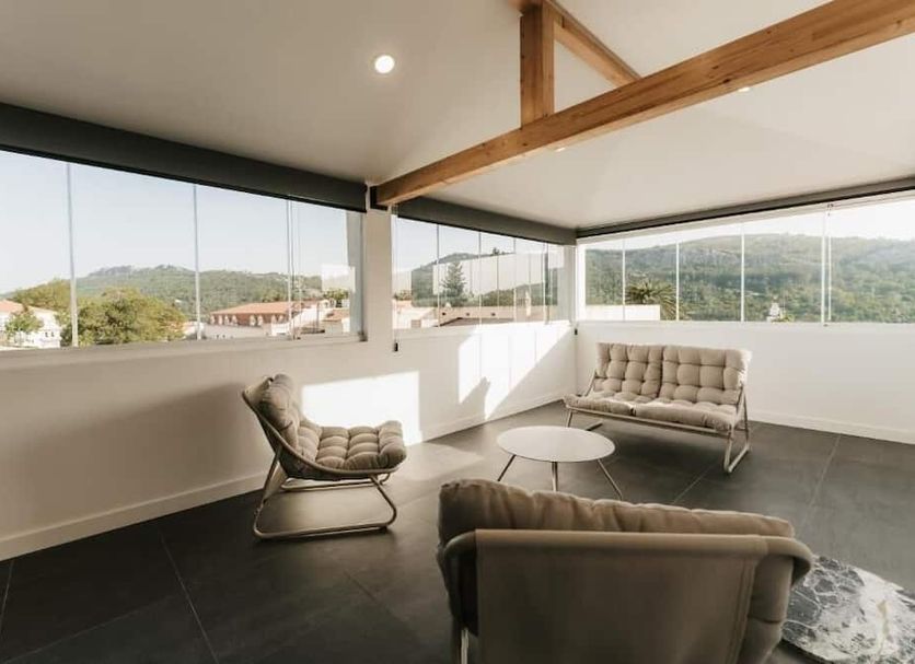 Casa do Parque Nature & Heritage Hotel in Castelo de Vide: bright lounge with panoramic hill views