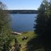 Lakeside Bed & Breakfast in Florence with lake view, grassy lawn, and dock