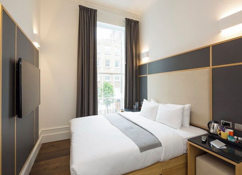 The Z Hotel at Gloucester Place London guest room with double bed and tall window