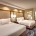 Fairfield Inn & Suites by Marriott Sierra Vista guest room with two beds, desk, chair and floor lamp