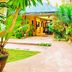 Muro Ami Beach Resort in Panglao with tropical garden path and bungalow entrance