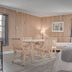 North Creek Lodge at Gore Mountain room with two beds, dining table, and pine-paneled walls in North Creek