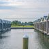 Blufin Bungalows & Marina in Chincoteague, waterfront bungalows lining a calm marina channel