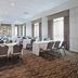 Hilton Garden Inn Montreal Airport meeting room in Montreal with round banquet tables and chairs