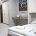 Hi Rabin - Jerusalem Hostel room with bunk beds, twin beds, desk and wall art in Jerusalem