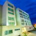Sonesta Hotel Valledupar in Valledupar, exterior view of a modern multi-story hotel at dusk