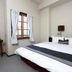 Hakuba Gondola Hotel guest room in Hakuba with bed, windows, desk and curtains