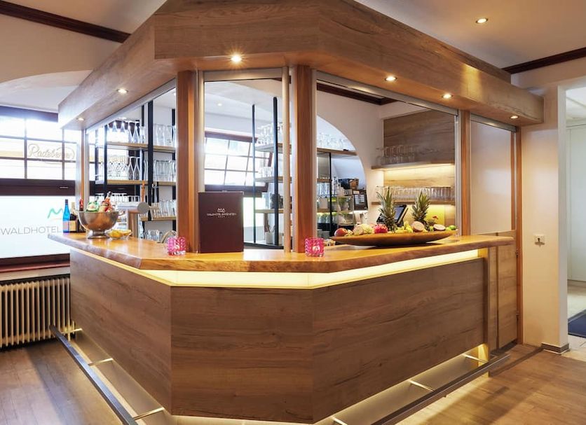 Waldhotel Bärenstein in Horn-Bad Meinberg lobby bar with wood-paneled counter and fruit display
