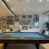 Hotel Asgard in Gersthofen: indoor billiards table with framed black-and-white photos on the wall