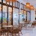 Hotel Fariones in Tías features a bright terrace with woven chairs and hanging pendant lamps