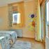 Hotel Stella di Mare in Bečići: twin beds, bright room, balcony door, and window with curtains
