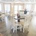 Amelia Hotel at the Beach in Fernandina Beach breakfast area with white tables and chairs