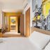 B&B Hotel Palermo Quattro Canti room with bed, desk, window and colorful mural in Palermo