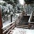 Arrowhead Mountain Inn in Lake Arrowhead with snow-covered outdoor stairs and trees