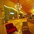 Gazelle Resort & Spa in Karacasu: warm lobby with wood ceiling, lounge seating and chandelier